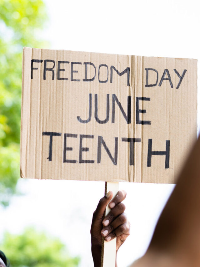 concept of Juneteenth freedom day march showing by close up protesting hands sign board - concept of activism, justice and demonstration